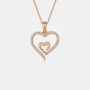 a heart pendant with two hearts on a chain