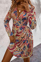 a woman in a red and blue paisley print dress