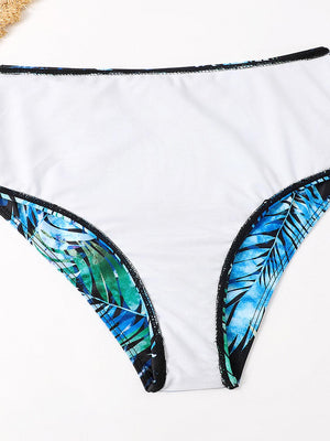 a women's bikini bottom with a tropical print