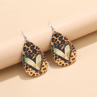 a pair of leopard print tear shaped earrings