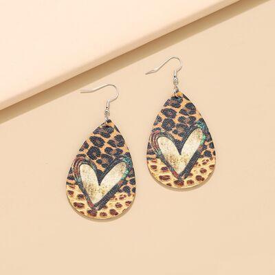 a pair of leopard print tear shaped earrings