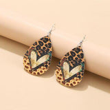 a pair of leopard print tear shaped earrings