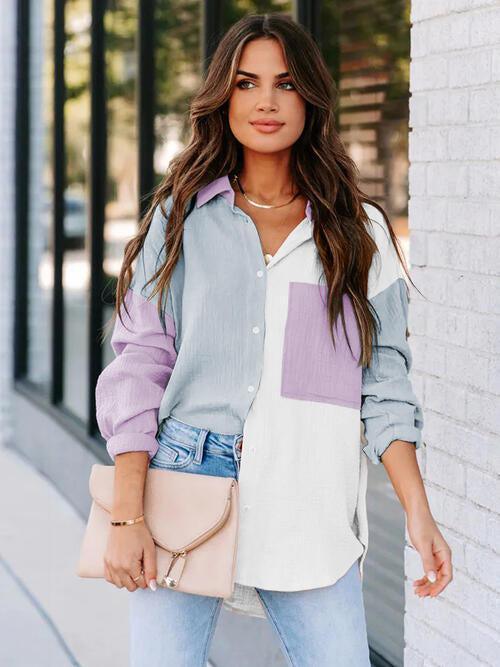 a woman standing next to a white brick wall