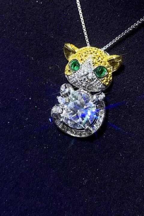 a necklace with a cat on top of it