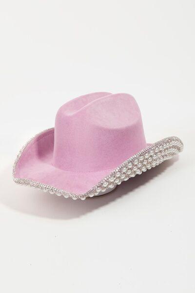 a pink cowboy hat with a beaded brim