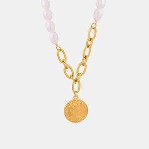 a necklace with a coin on a chain