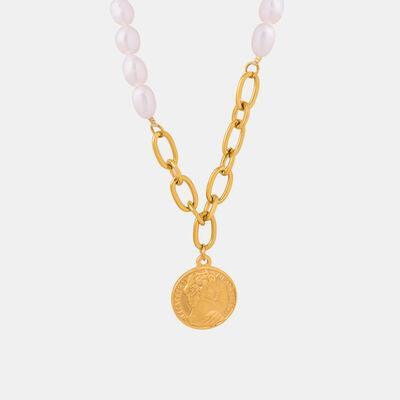 a necklace with a coin on a chain