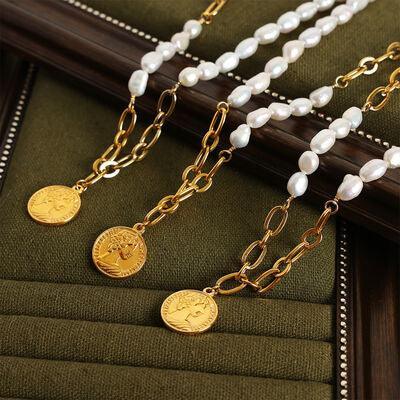 a close up of a number of necklaces on a table