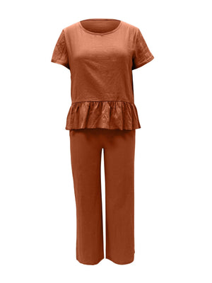 a woman wearing a brown top and pants