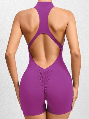 the back of a woman in a purple swimsuit