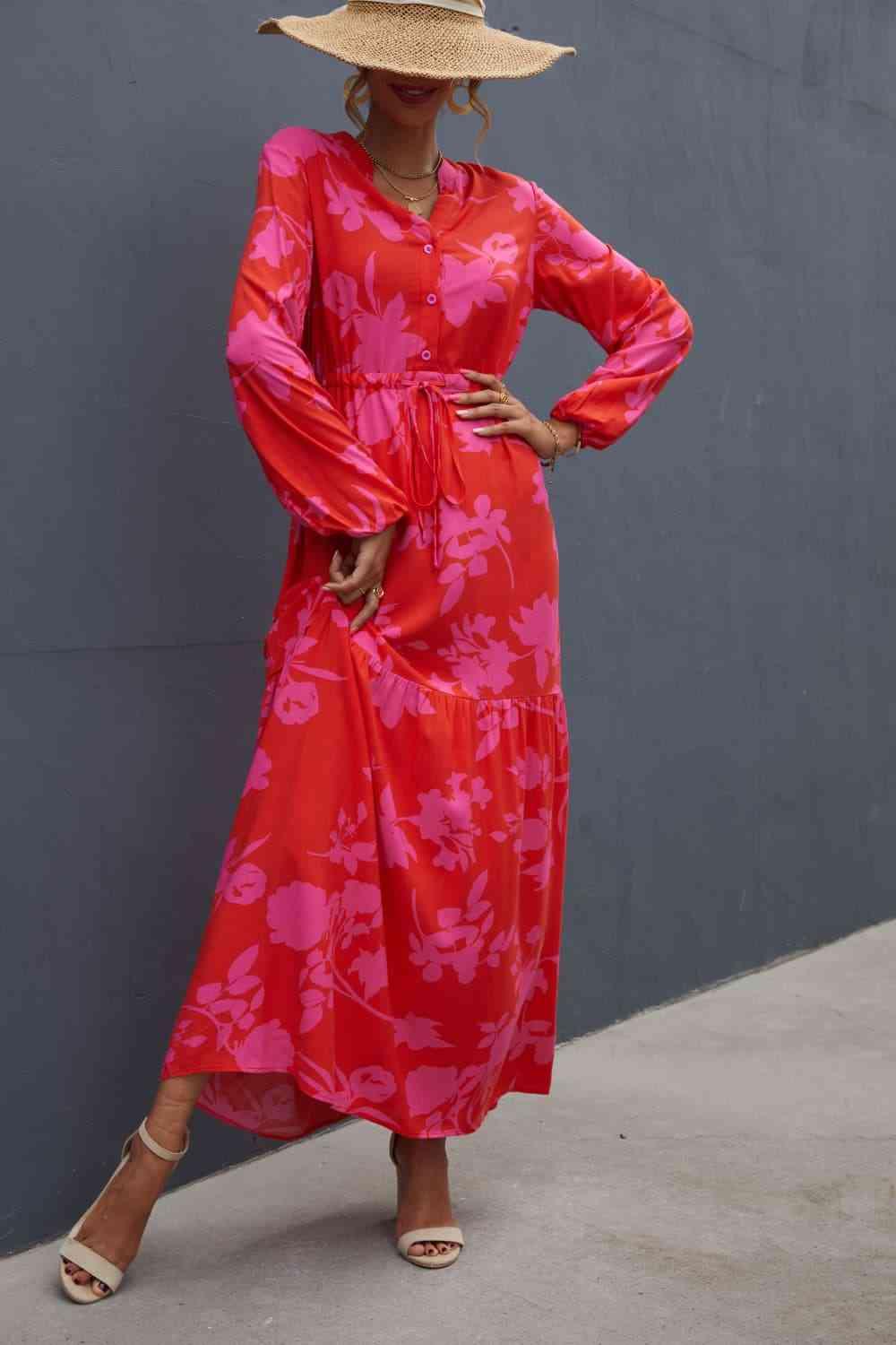 a woman wearing a red dress and a straw hat