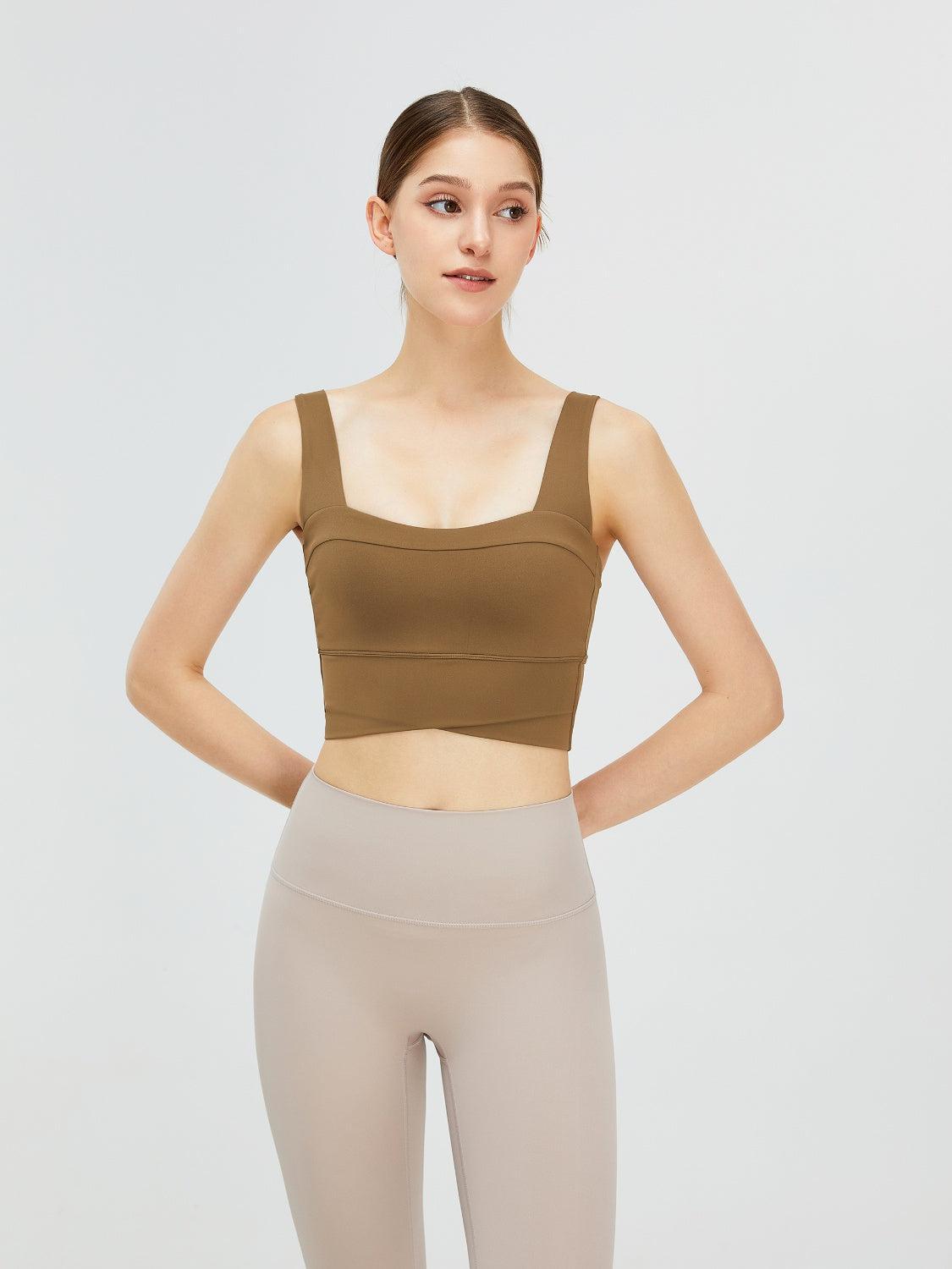 a woman in a crop top and leggings