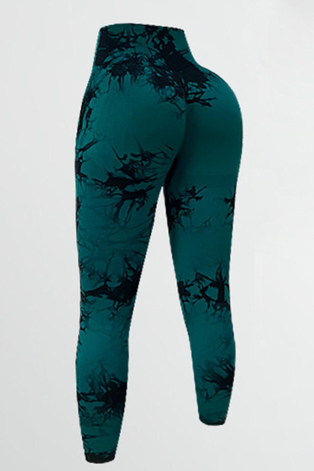 a woman's leggings with a green and black pattern