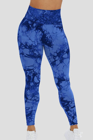 a woman wearing a blue leggings with a blue marble pattern