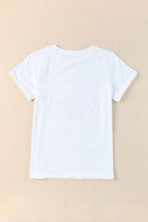 a white t - shirt hanging on a wall