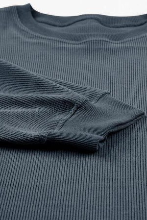 a close up of a shirt on a white surface