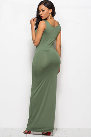 a woman in a long green dress