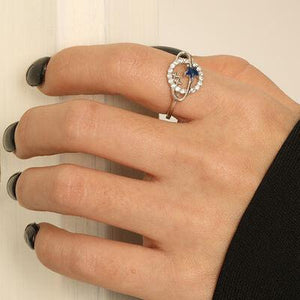 a woman's hand with a ring on it