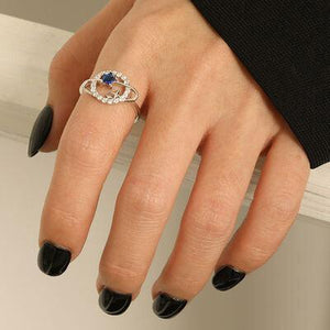 a woman's hand with a ring on it