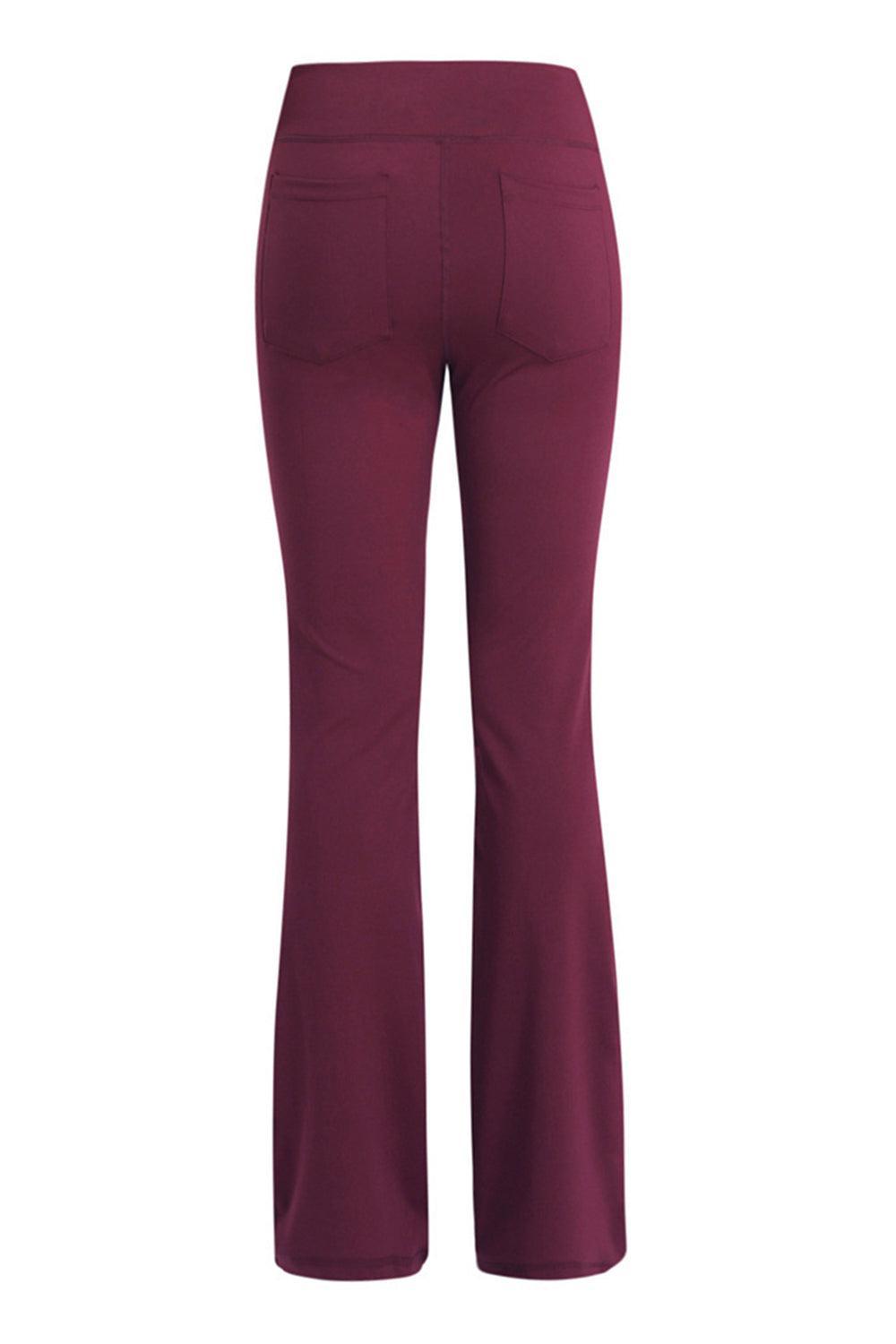 a woman wearing a maroon pants and heels