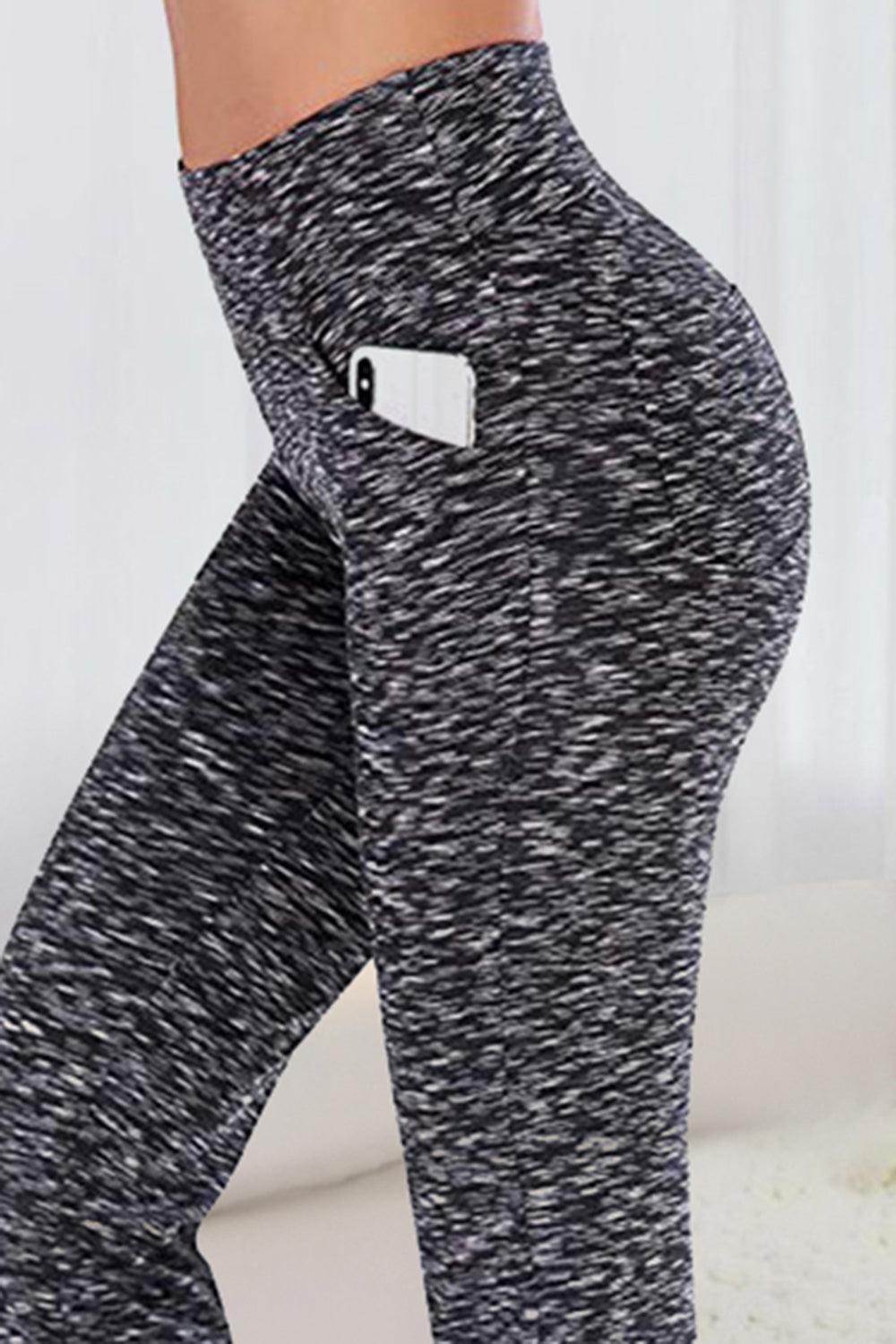 a woman in black and white leggings with a pocket