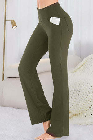 a woman wearing a pair of green pants