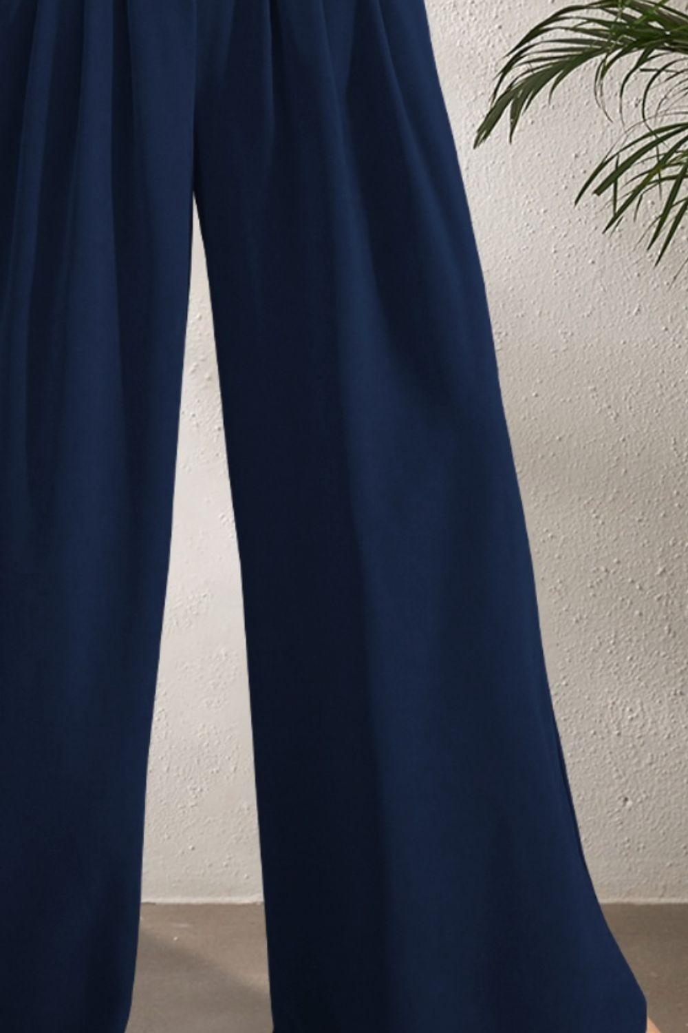 a close up of a person wearing a pair of blue pants