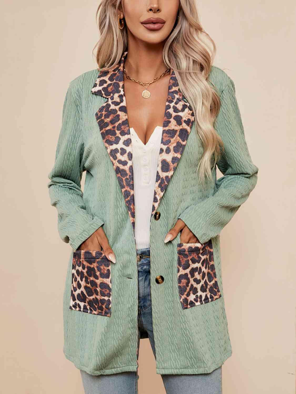 a woman wearing a green jacket with a leopard print pocket