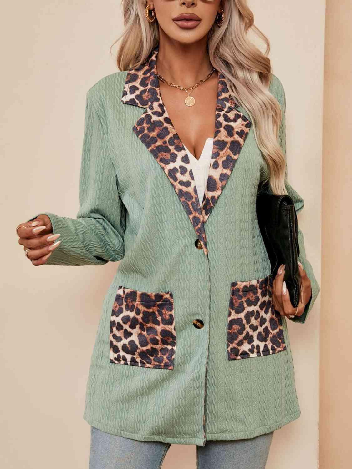 a woman wearing a green jacket with leopard print