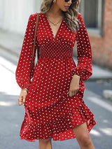 a woman wearing a red polka dot dress