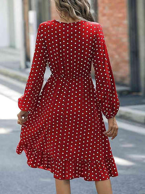 a woman in a red polka dot dress