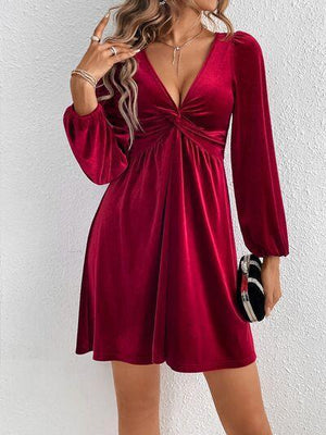 a woman wearing a red velvet dress