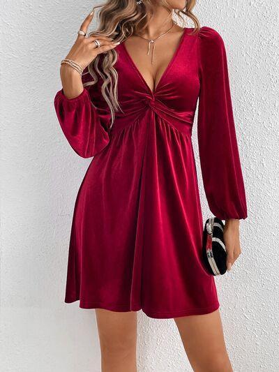 a woman wearing a red velvet dress