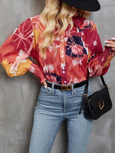 a woman wearing a floral shirt and jeans