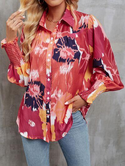 a woman wearing a red floral shirt and jeans