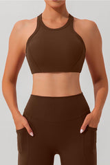 a woman wearing a brown sports bra top