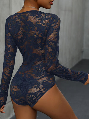 a woman in a blue bodysuit with sheer lace