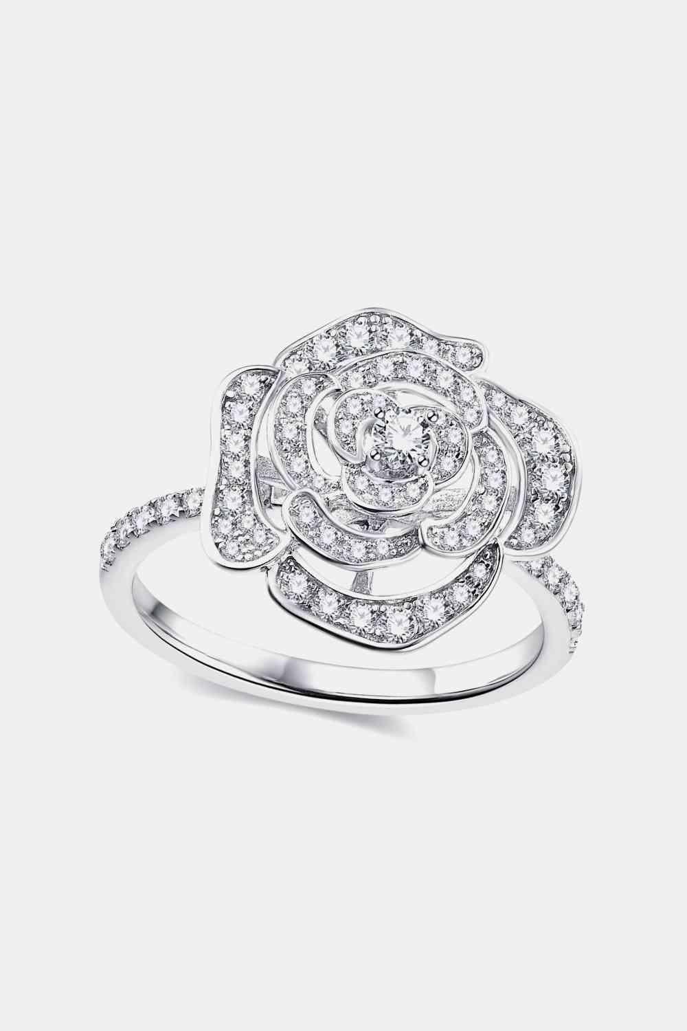 a white gold ring with a flower design