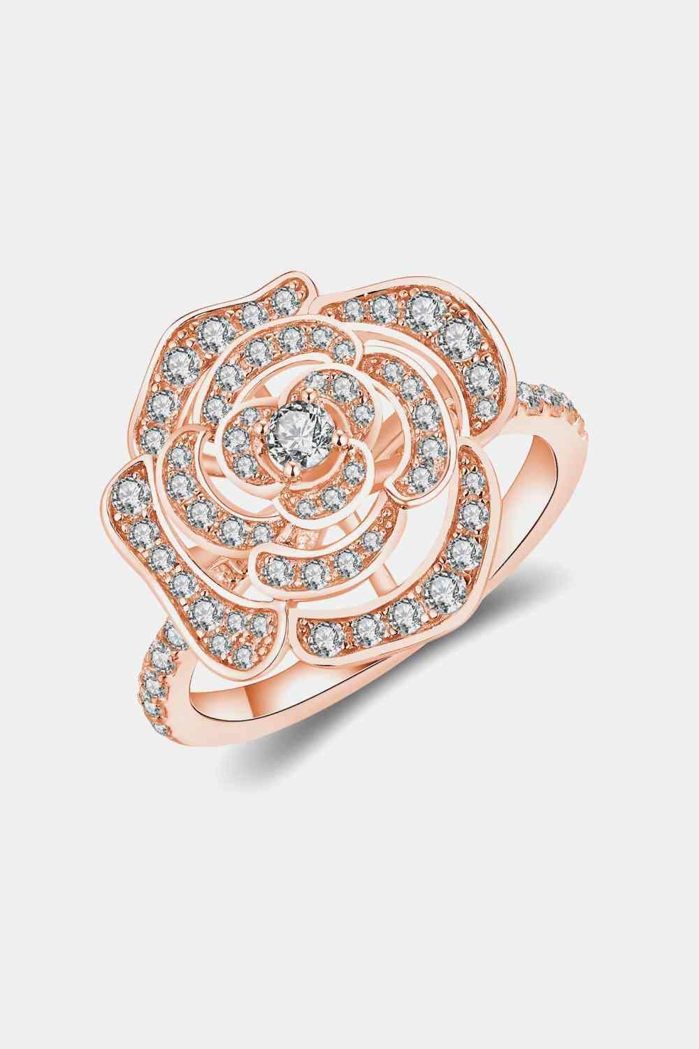 a rose shaped ring with diamonds on it