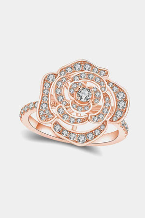 a rose shaped ring with diamonds on it