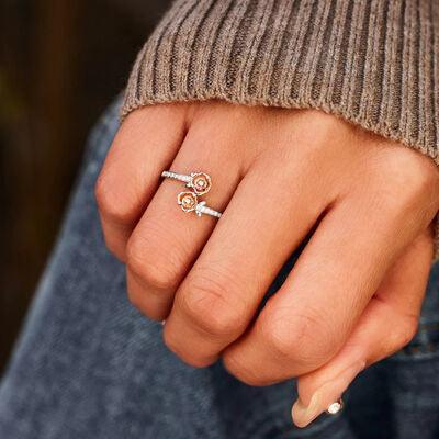 a woman's hand with a ring on it