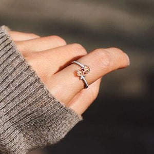 a woman's hand with a ring on it