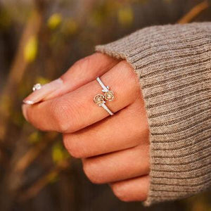 a woman's hand with a ring on it