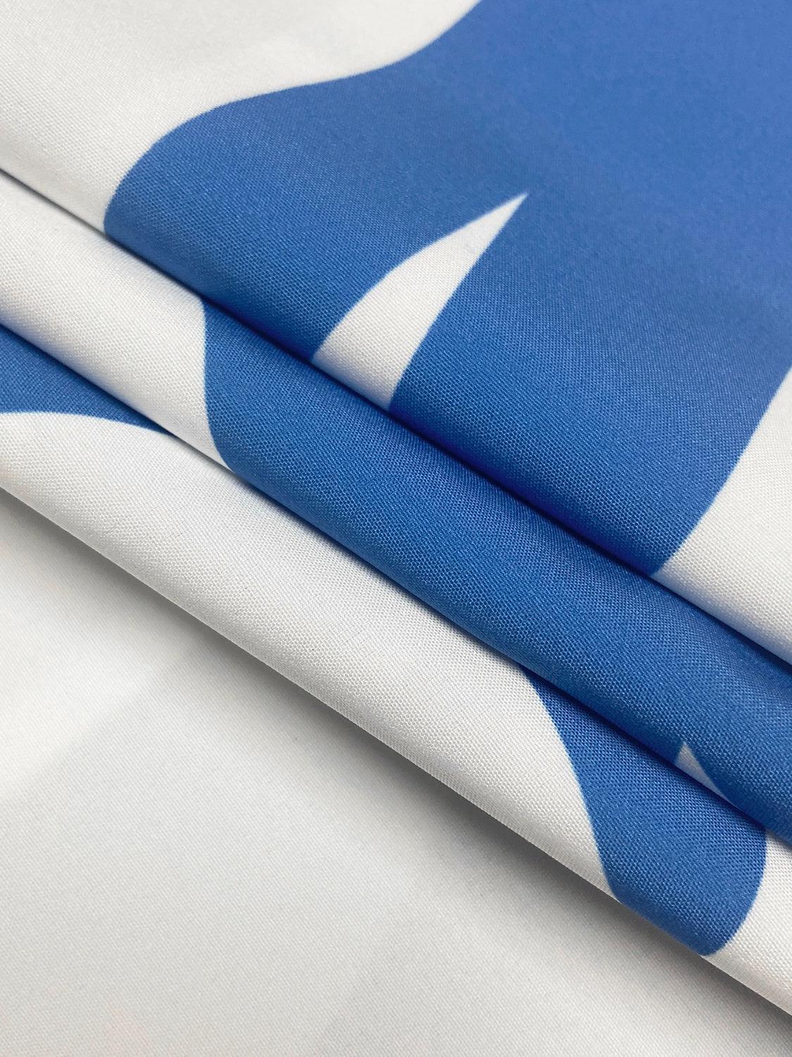 a close up of a blue and white fabric