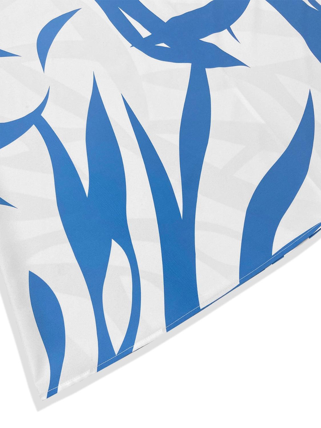 a close up of a blue and white design on a sheet