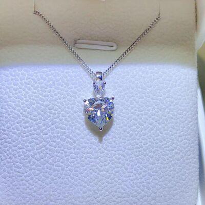 a necklace with a heart shaped diamond on it