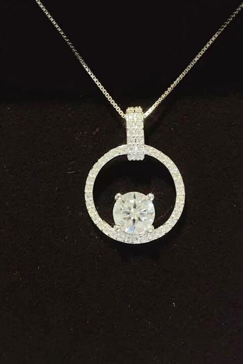 a necklace with a diamond in the middle of it