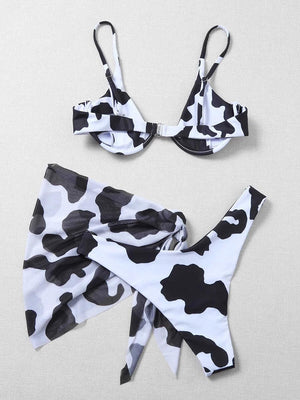 a bathing suit with a cow print on it