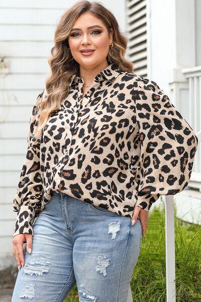 a woman wearing a leopard print shirt and ripped jeans