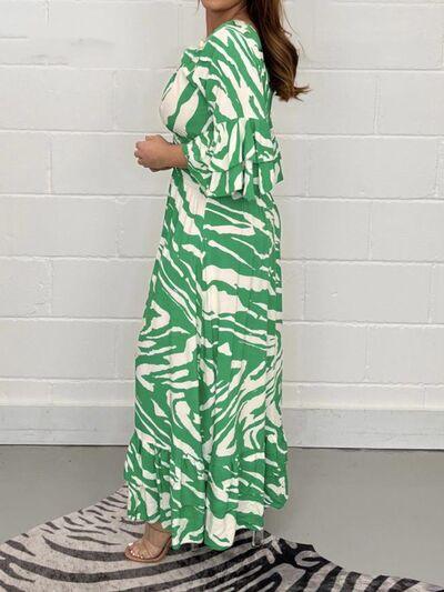 a woman standing on a zebra rug wearing a green and white dress
